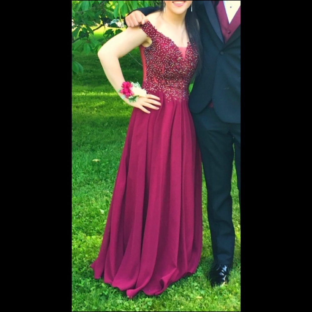 STUNNING PROM DRESS! Worn once, size 7, color is a gorgeous rich burgundy.